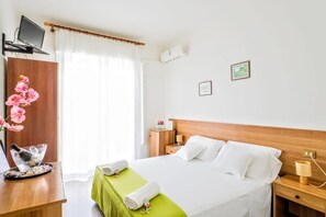 Quadruple Room, Balcony | Minibar, desk, free WiFi, bed sheets