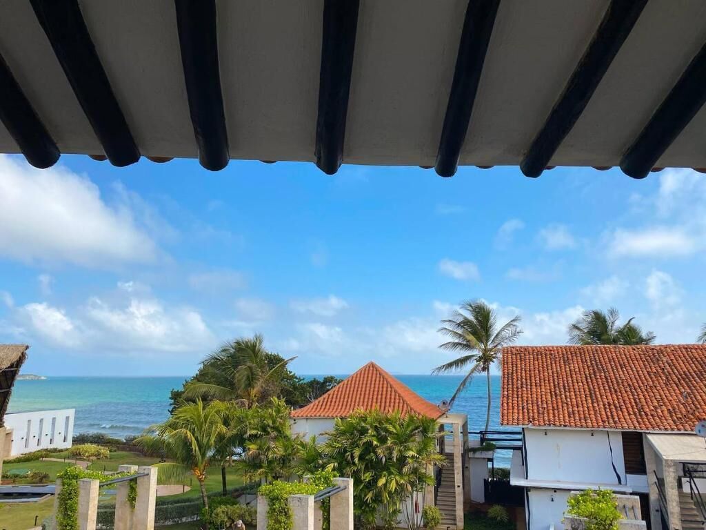 Deluxe Room, 1 King Bed, Balcony, Garden View | Property grounds