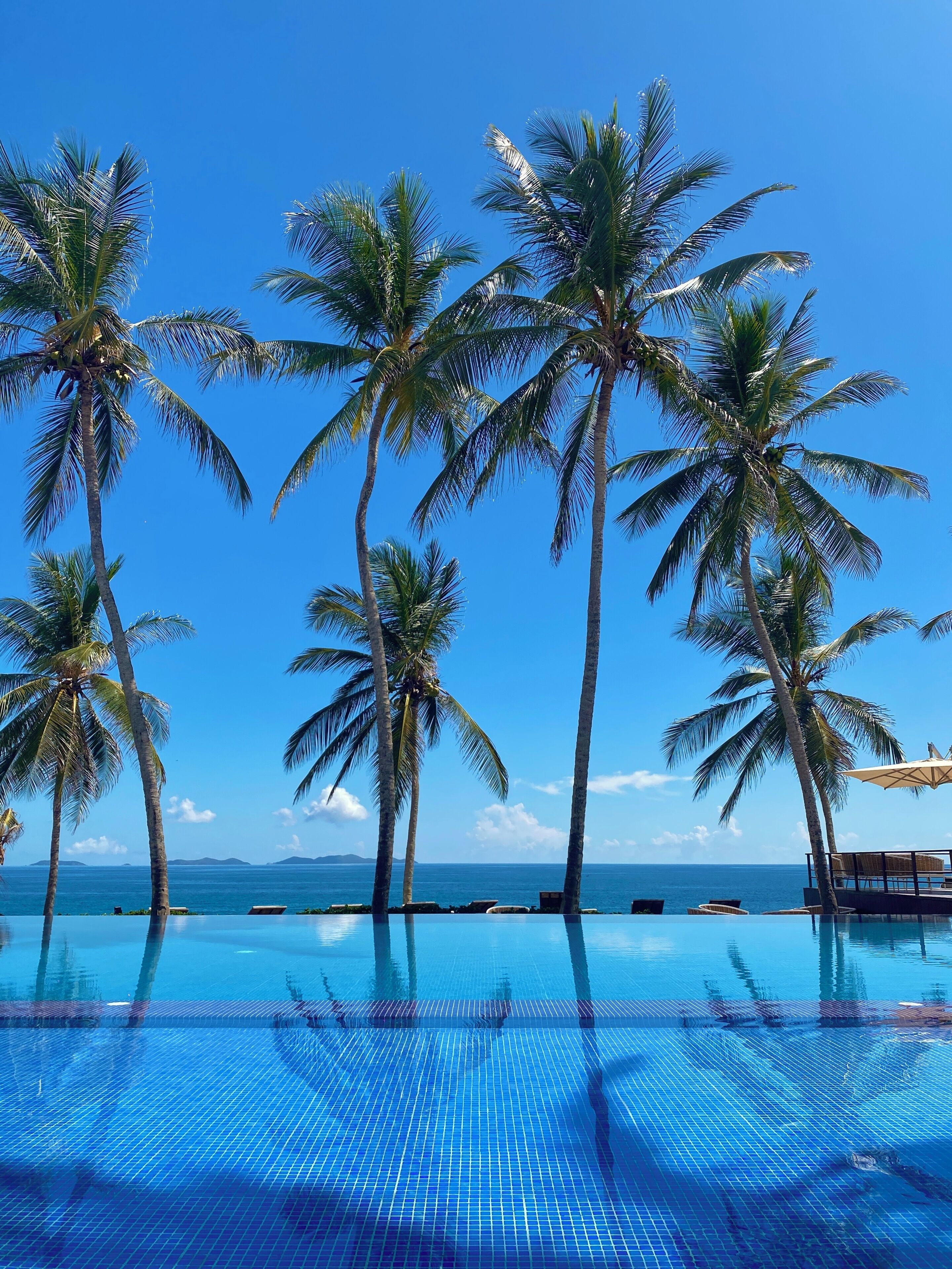 Outdoor pool, open 8:30 AM to 5:00 PM, pool umbrellas