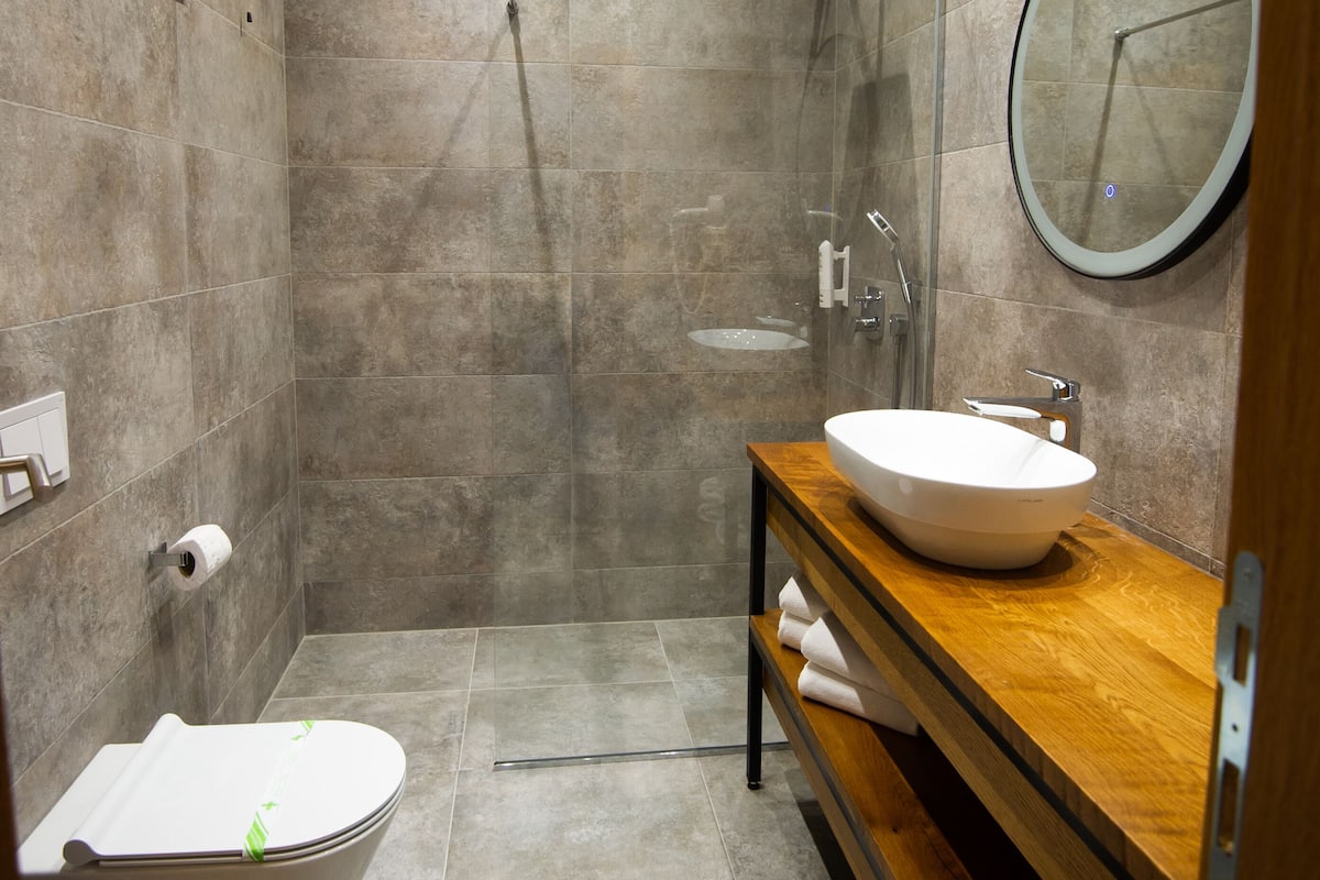 combined shower/bathtub, free toiletries, hair dryer, dressing gowns