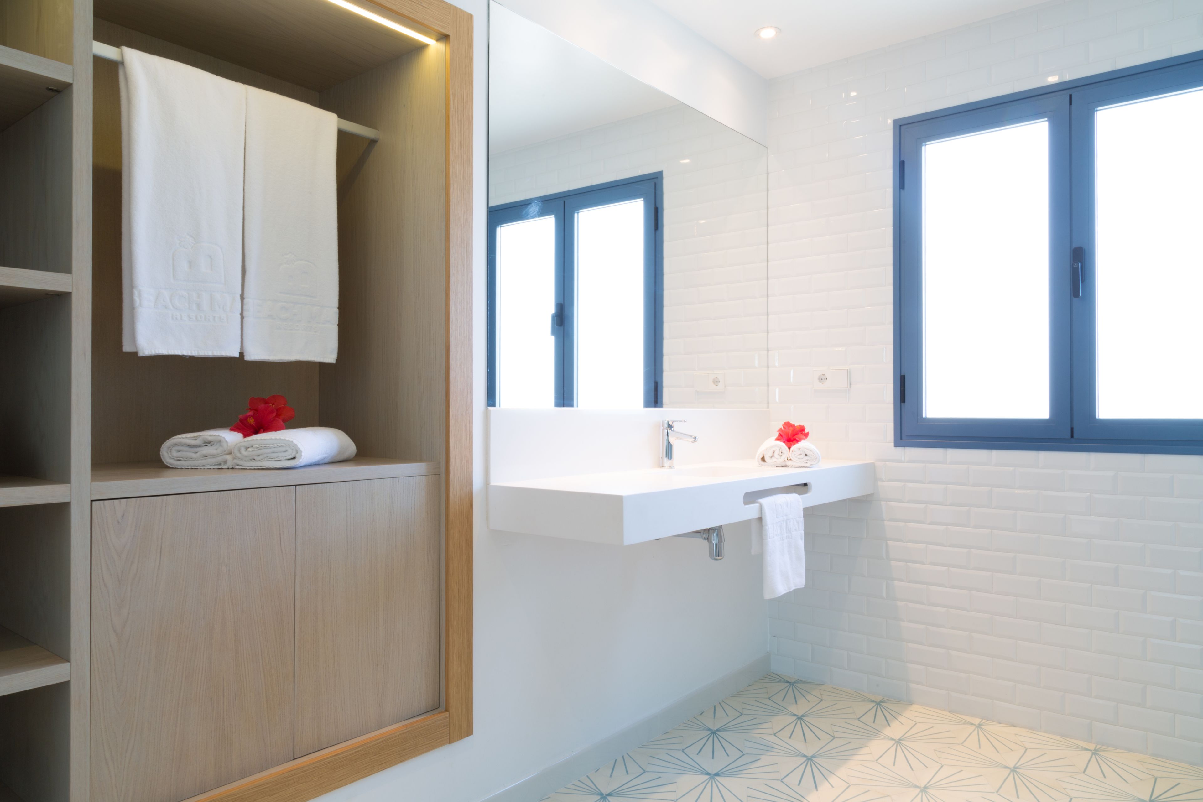 shower, rainfall showerhead, hair dryer, towels