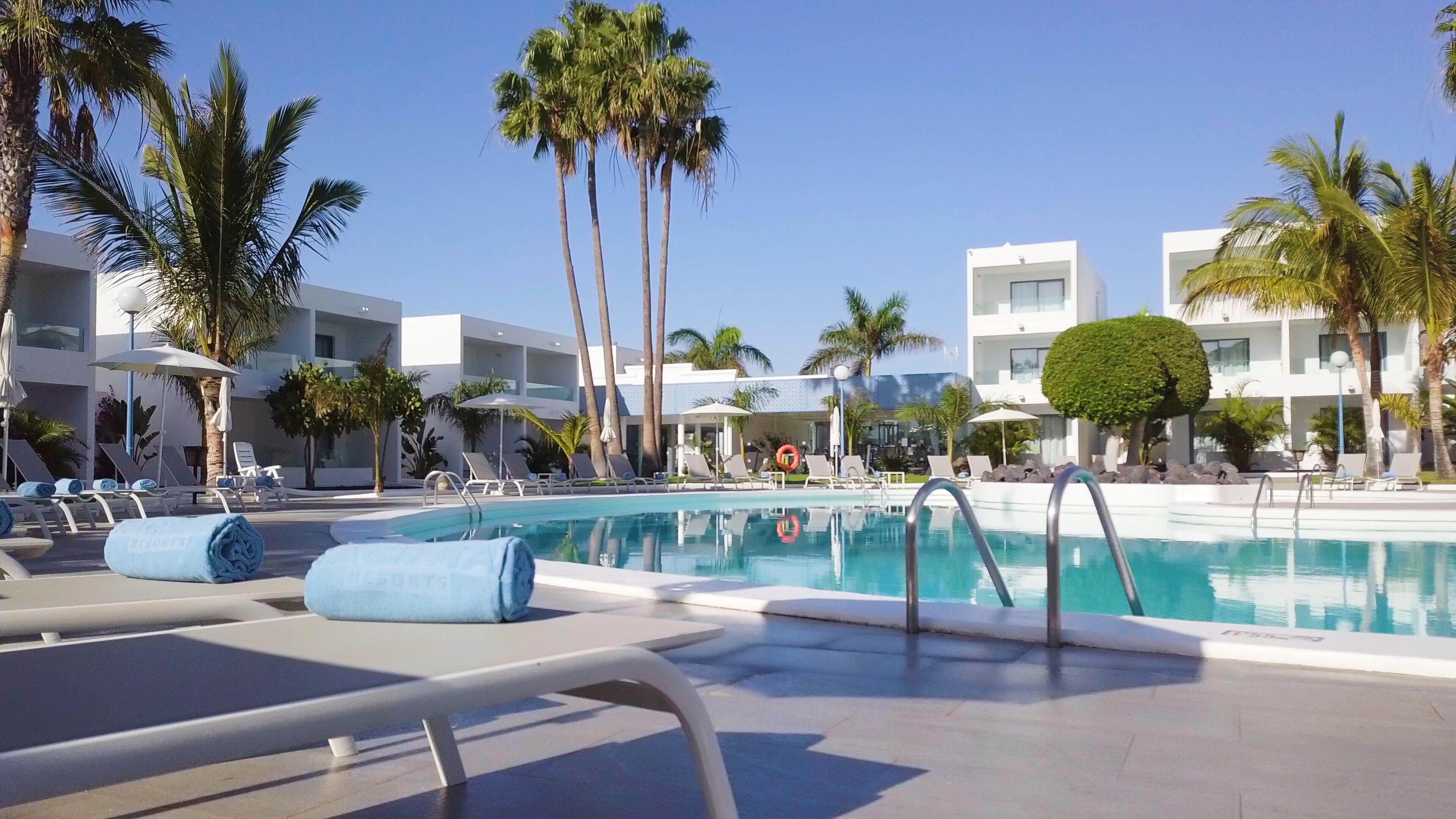 2 outdoor pools, open 10:00 am to 6:00 pm, pool umbrellas, pool loungers