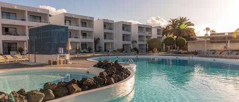 2 outdoor pools, open 10:00 AM to 6:00 PM, pool umbrellas, pool loungers