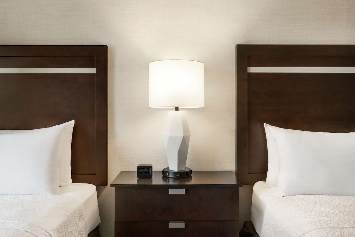 Hypo-allergenic bedding, desk, laptop workspace, blackout curtains