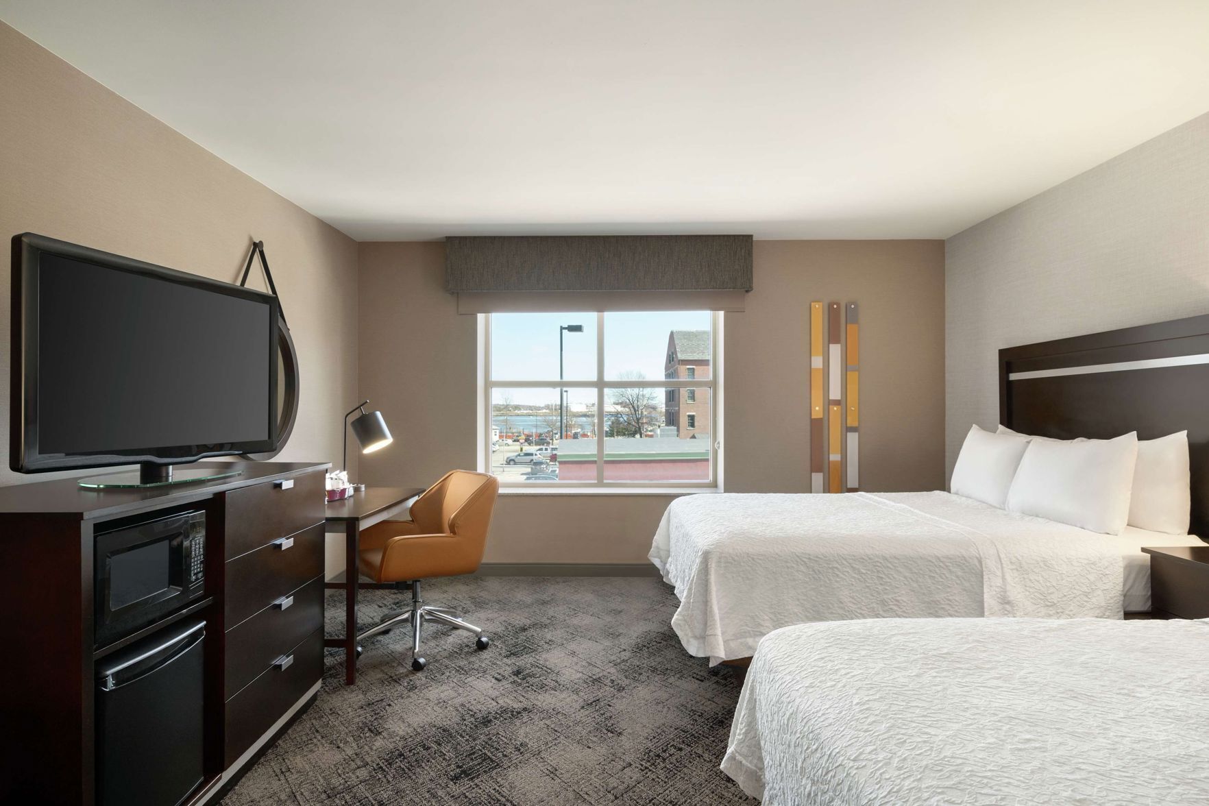 Hypo-allergenic bedding, desk, laptop workspace, blackout drapes