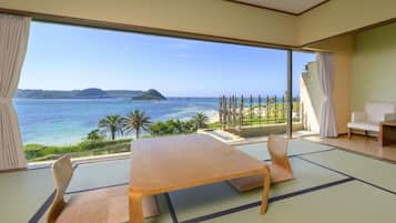 A tatami mat room with a view of the sea and mountains.