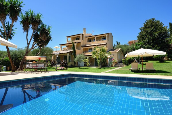 Seasonal outdoor pool, open 9:30 AM to 8:30 PM, pool umbrellas