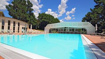 Indoor pool, seasonal outdoor pool, pool umbrellas, pool loungers