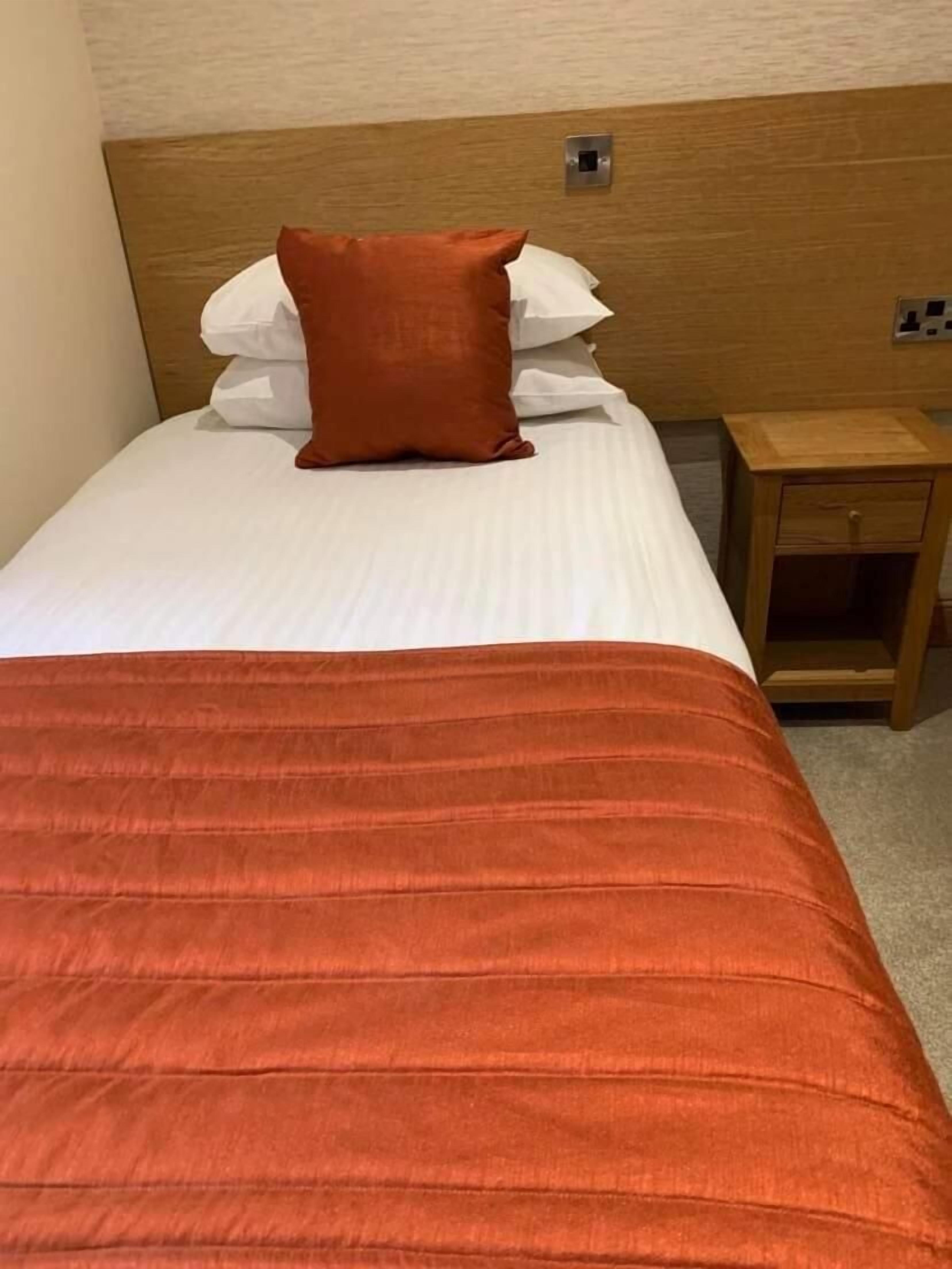 desk, iron/ironing board, bed sheets