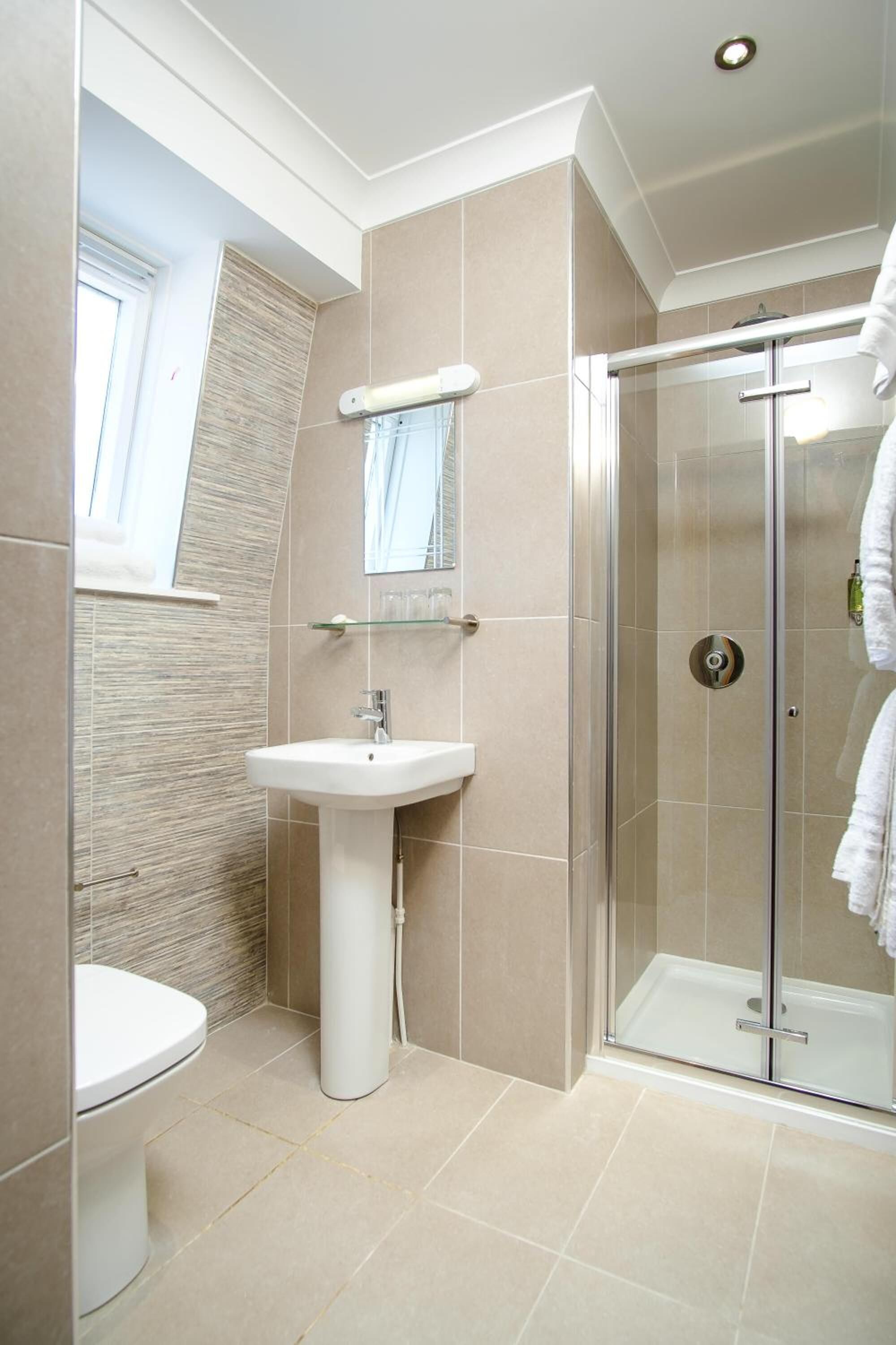 shower, free toiletries, hair dryer, towels