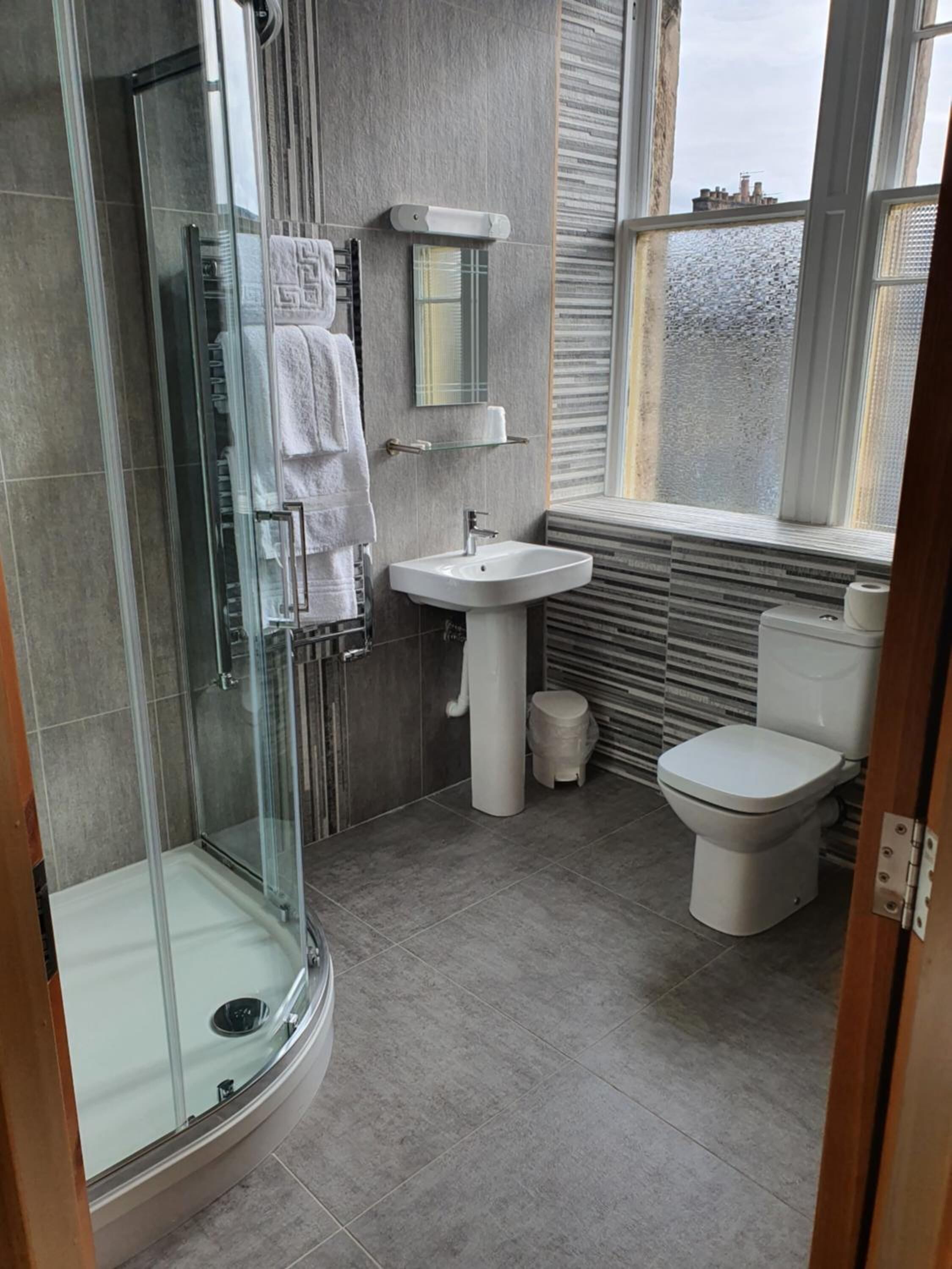 family room | bathroom | shower, free toiletries, hair dryer, towels