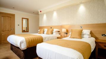 Family Room | Desk, iron/ironing board, bed sheets