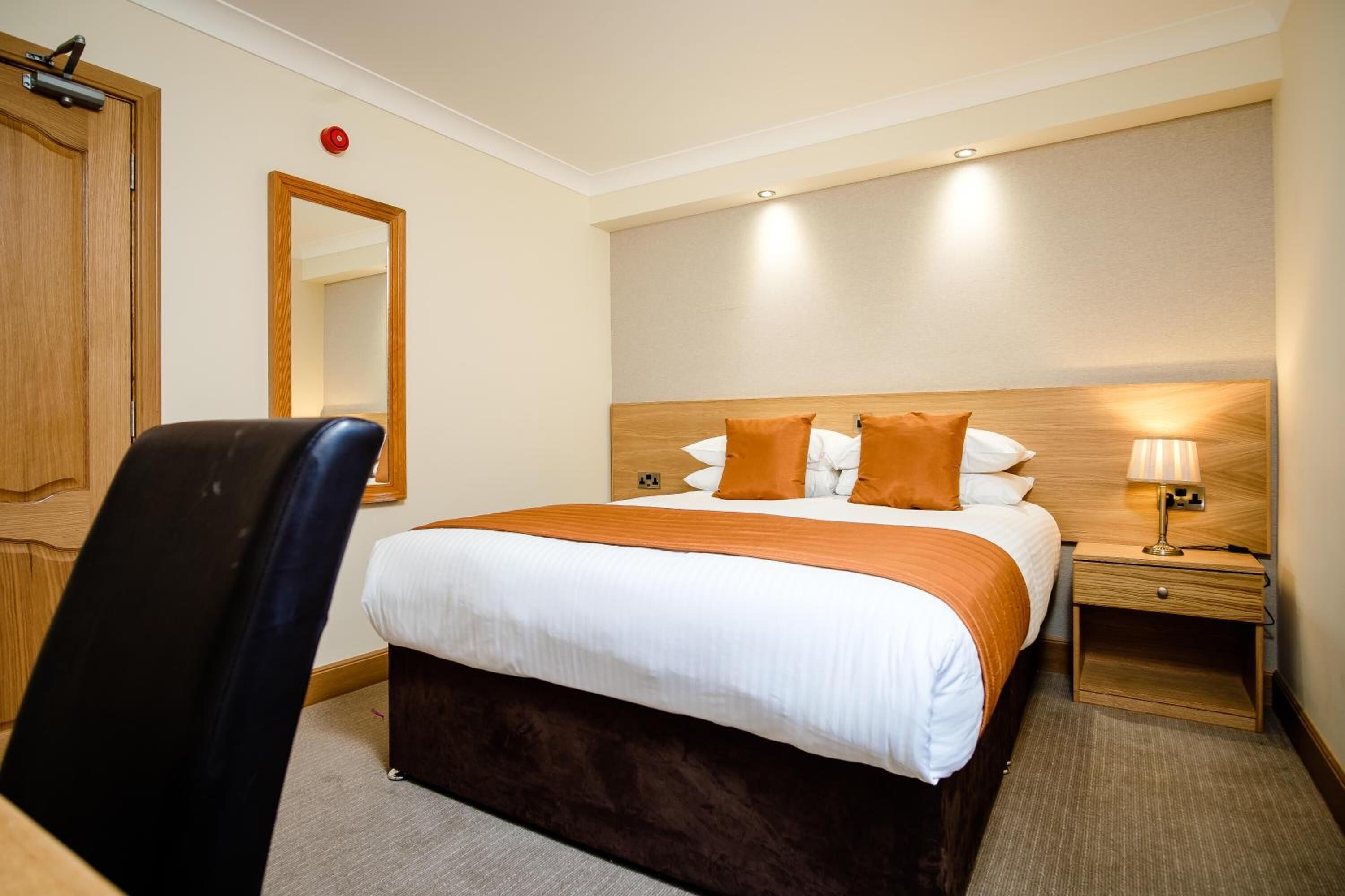 desk, iron/ironing board, bed sheets