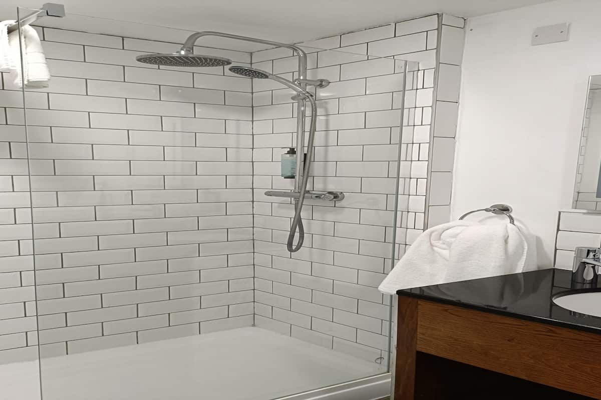 Suite, 1 King Bed, Non Smoking (Shower Only) | 1 bedroom, Select Comfort beds, desk, iron/ironing board