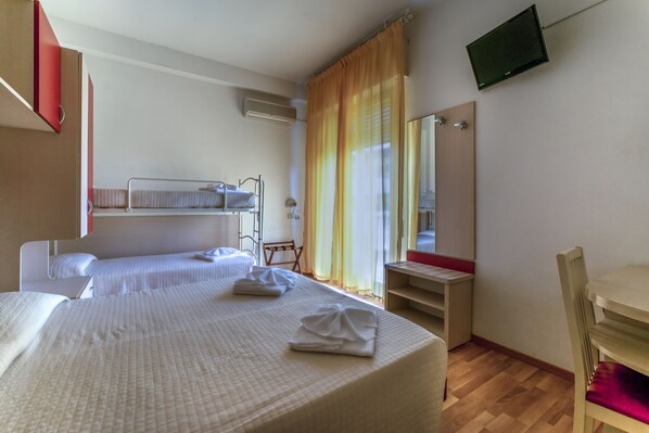 A hotel room with two beds, a TV, a desk, and a chair. - Hotel Stresa (Rimini)