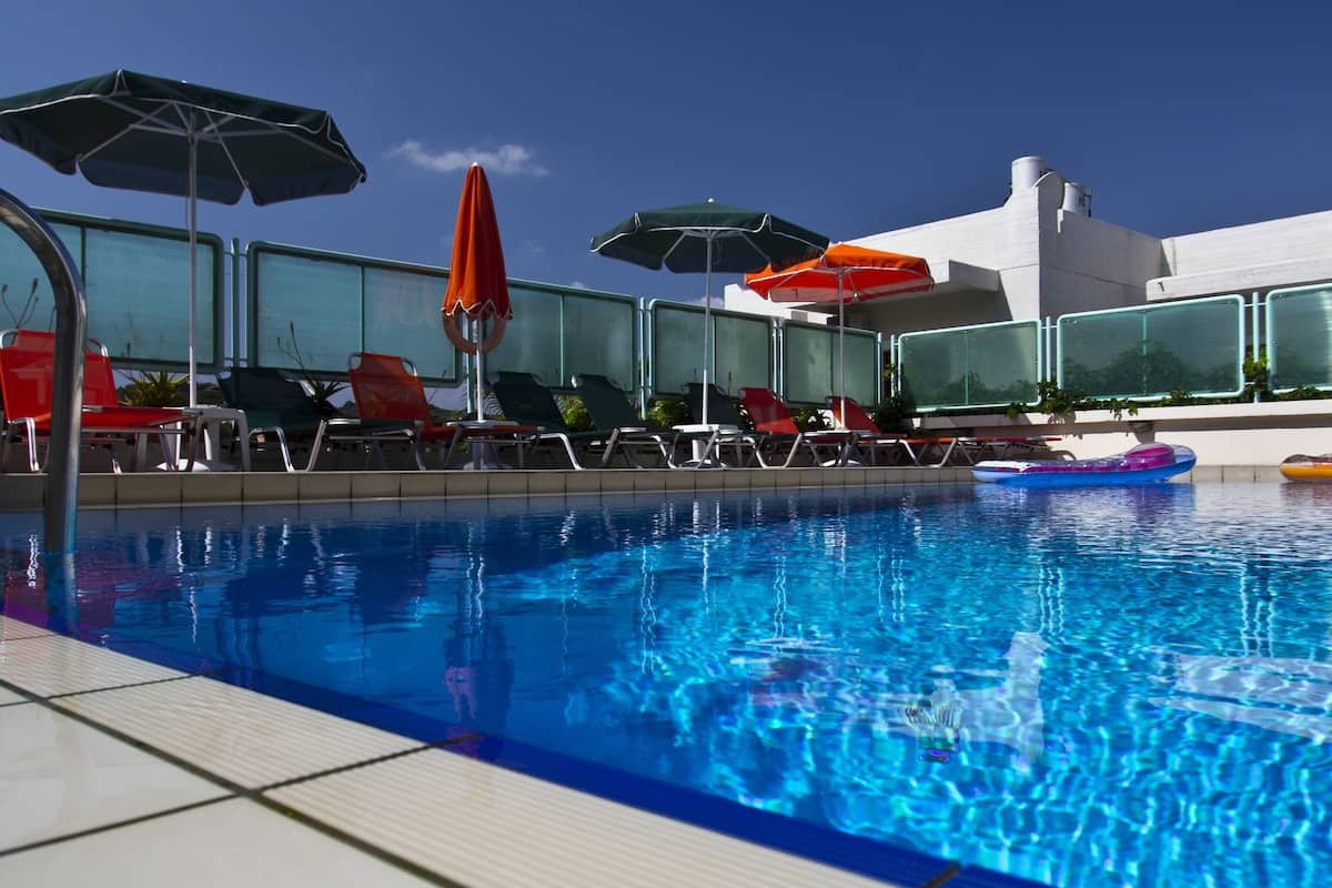 seasonal outdoor pool, open 9:00 am to 9:00 pm, pool umbrellas