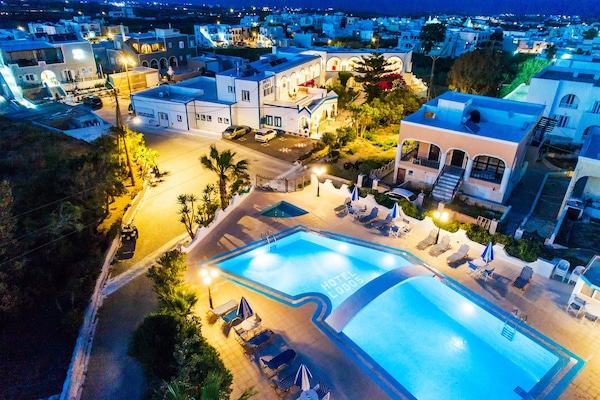 Seasonal outdoor pool, open 9:00 AM to 8:00 PM, pool umbrellas