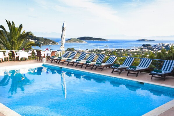 Outdoor pool, open 8:00 AM to 7:00 PM, pool umbrellas, sun loungers