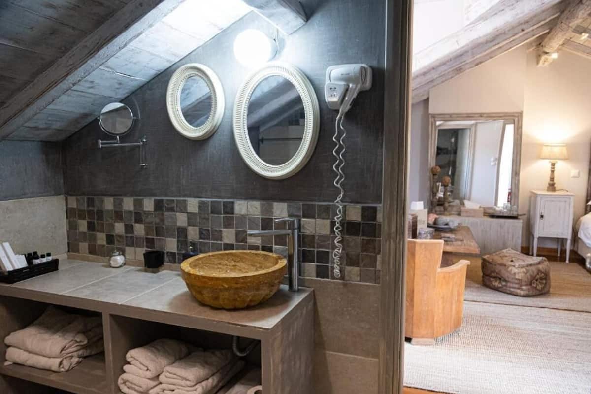 deluxe suite, balcony - attic (adiandi building, 3rd floor) | bathroom | shower, hair dryer, slippers, towels