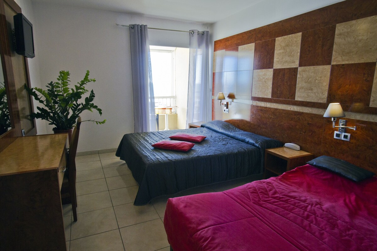 Desk, blackout curtains, free cots/infant beds, free WiFi