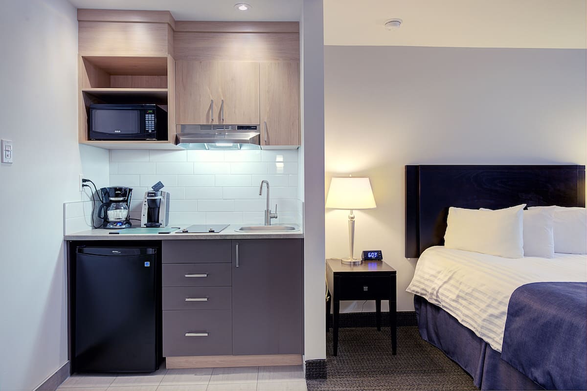 fridge, coffee/tea maker, electric kettle, dining tables