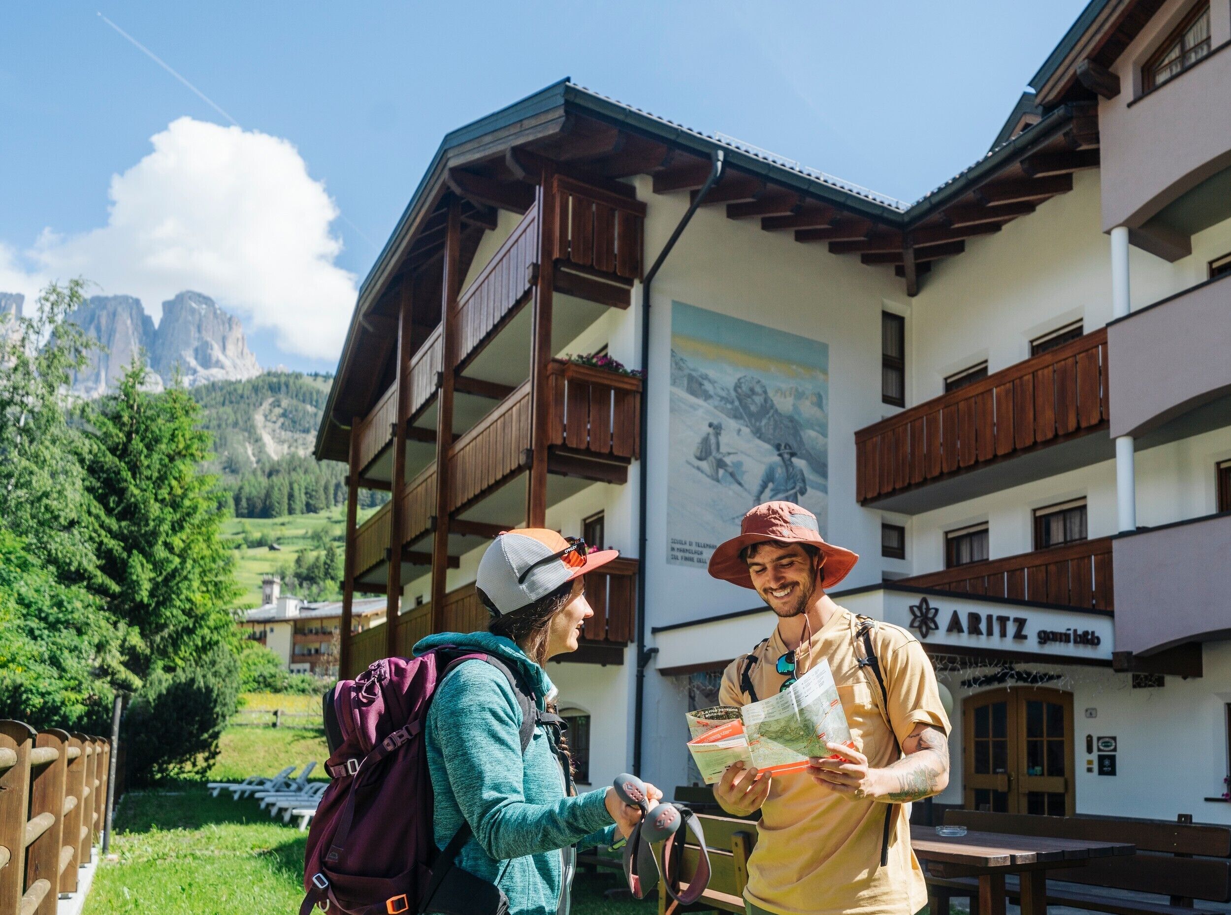 A building with wooden balconies and a mountain view.
