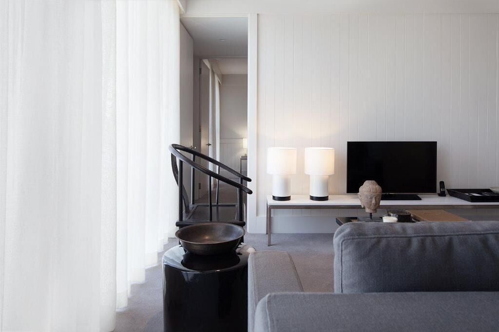 deluxe two bedroom apartment | living area | 48-inch lcd tv with digital channels, tv