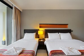 Standaard kamer | Luxe beddengoed, een kluis op de kamer, individueel gedecoreerd
