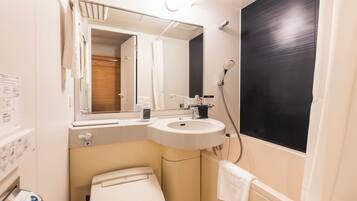 Combined shower/tub, free toiletries, hair dryer, slippers