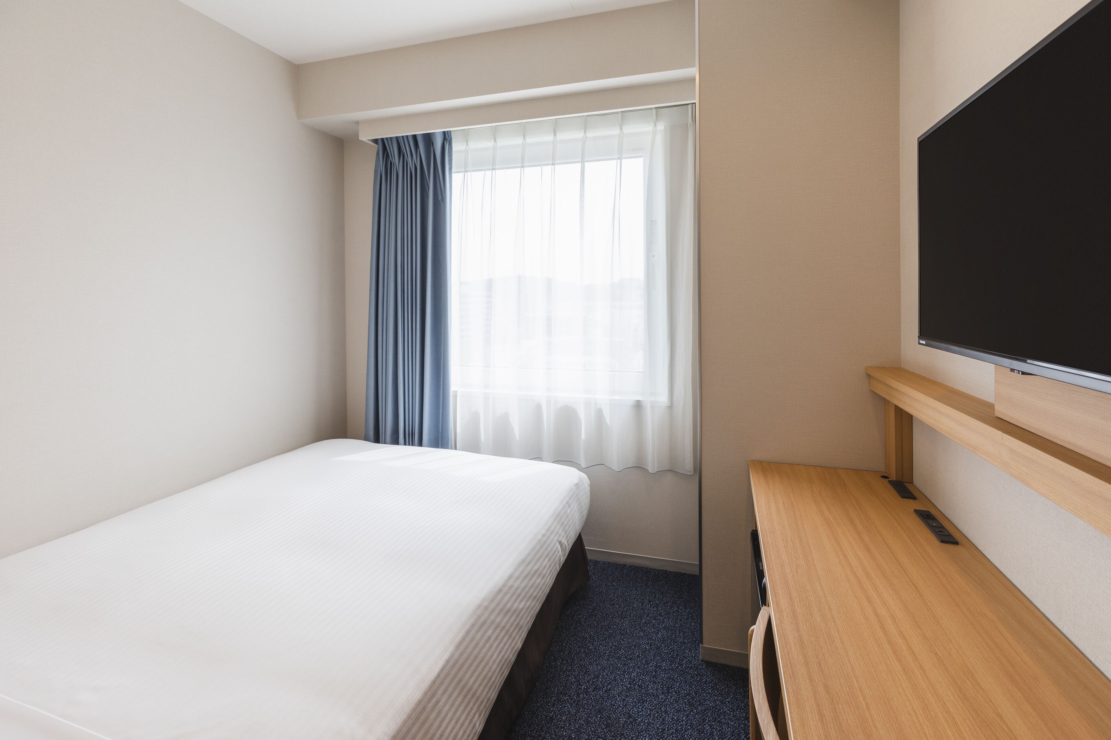 premium bedding, down duvets, desk, blackout curtains