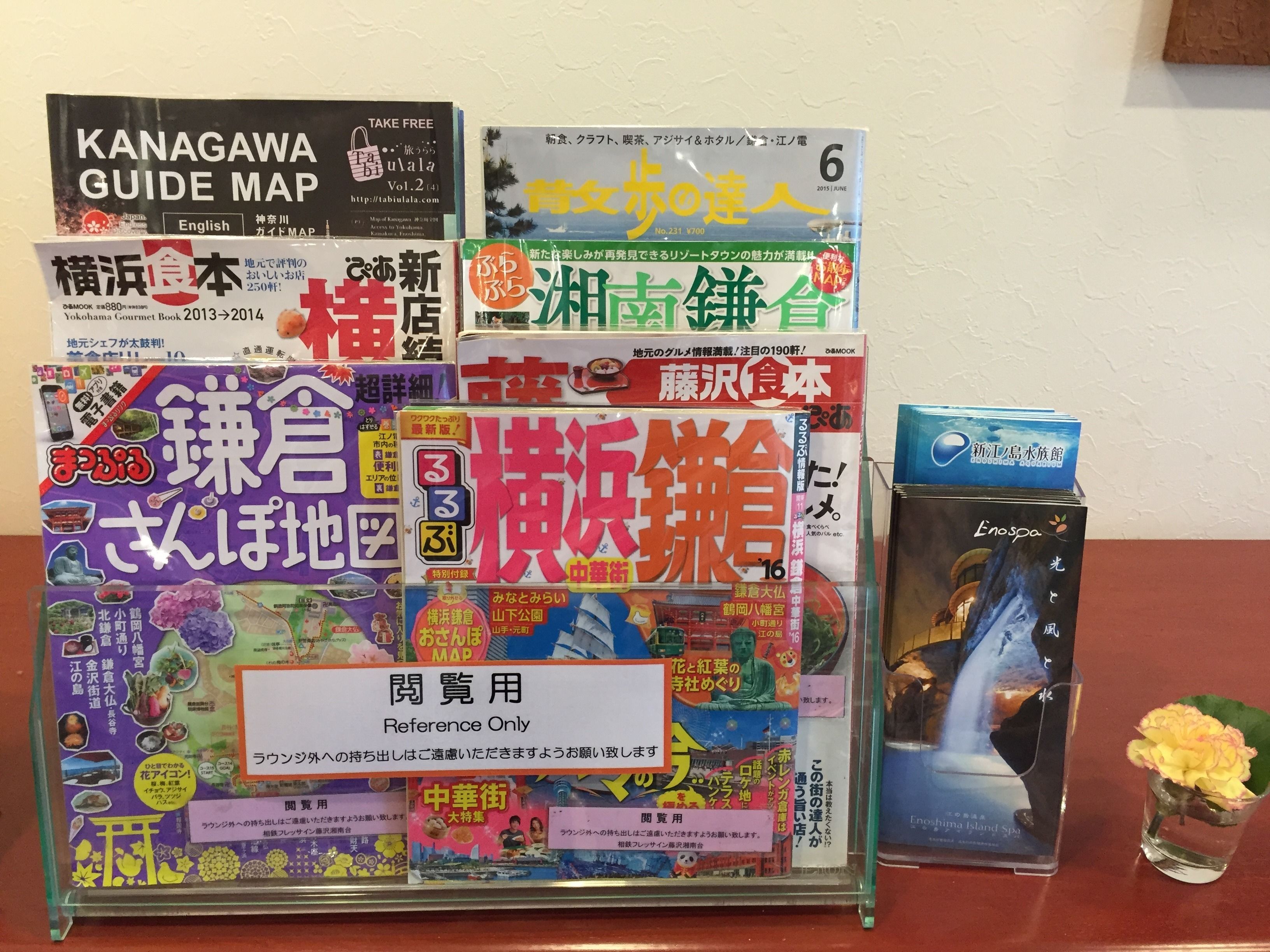 A display of various travel and guide books on a table.