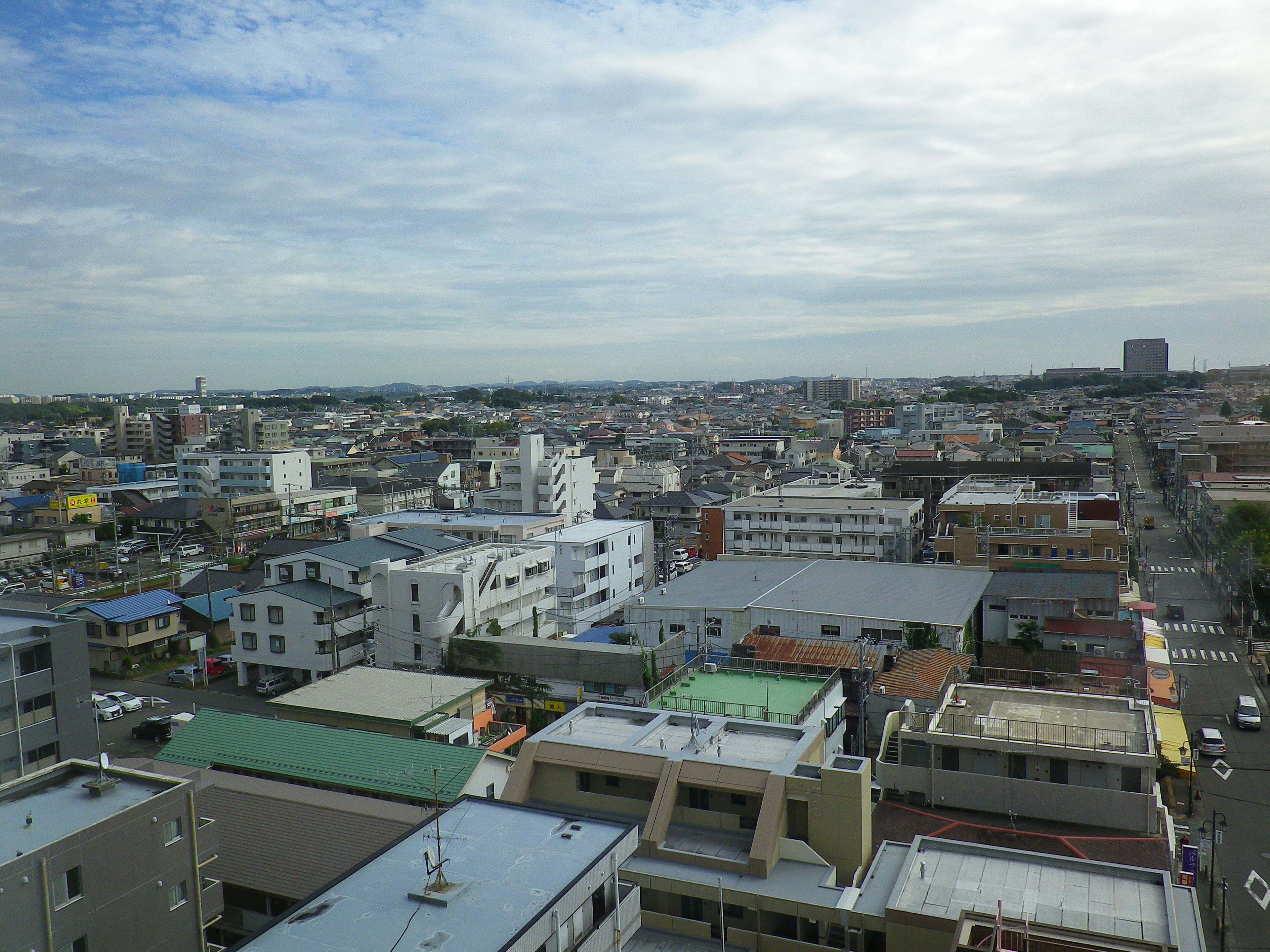 A densely packed urban area with various building types, including multi-story residential and commercial structures.