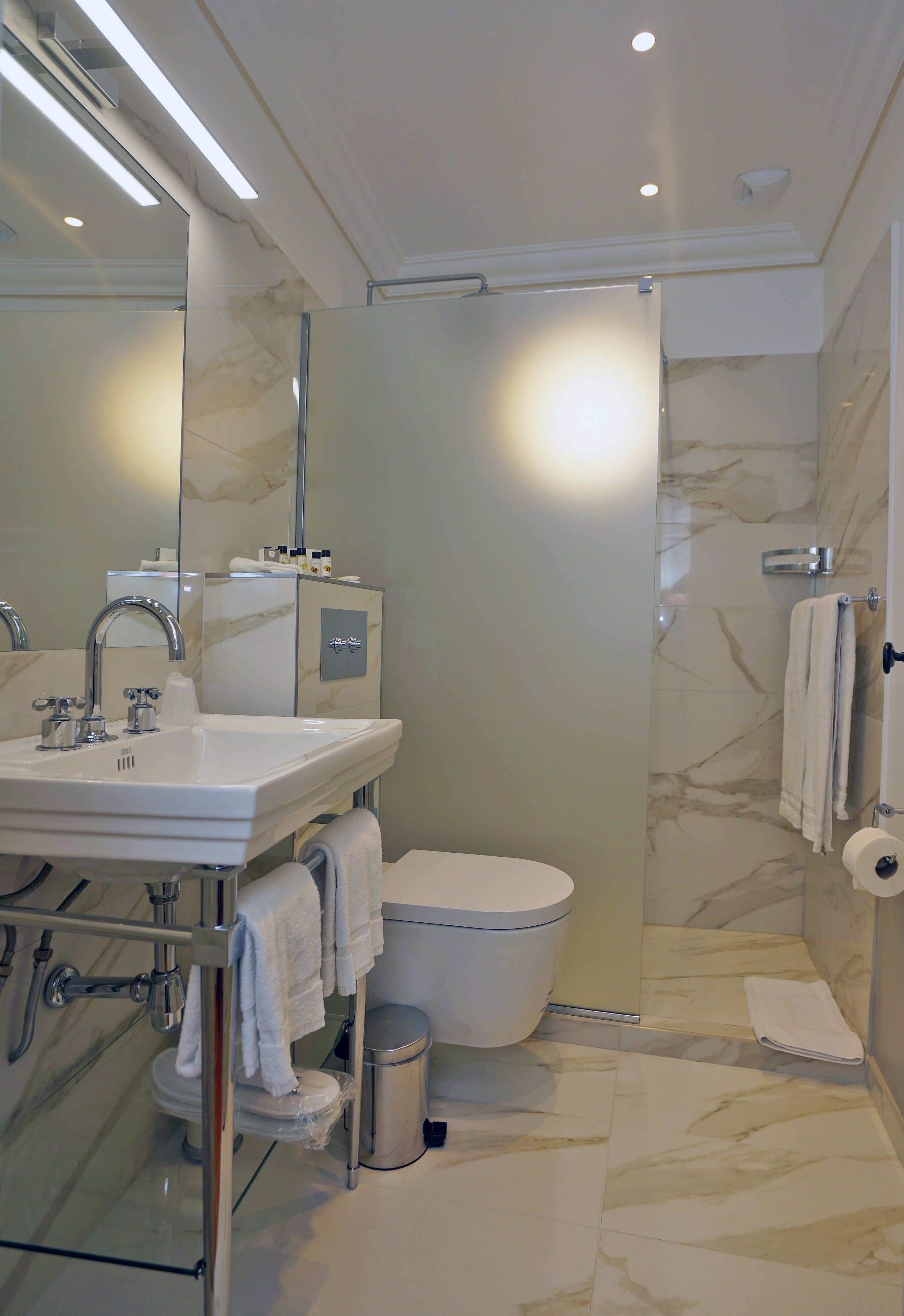 rainfall showerhead, designer toiletries, hair dryer, bathrobes