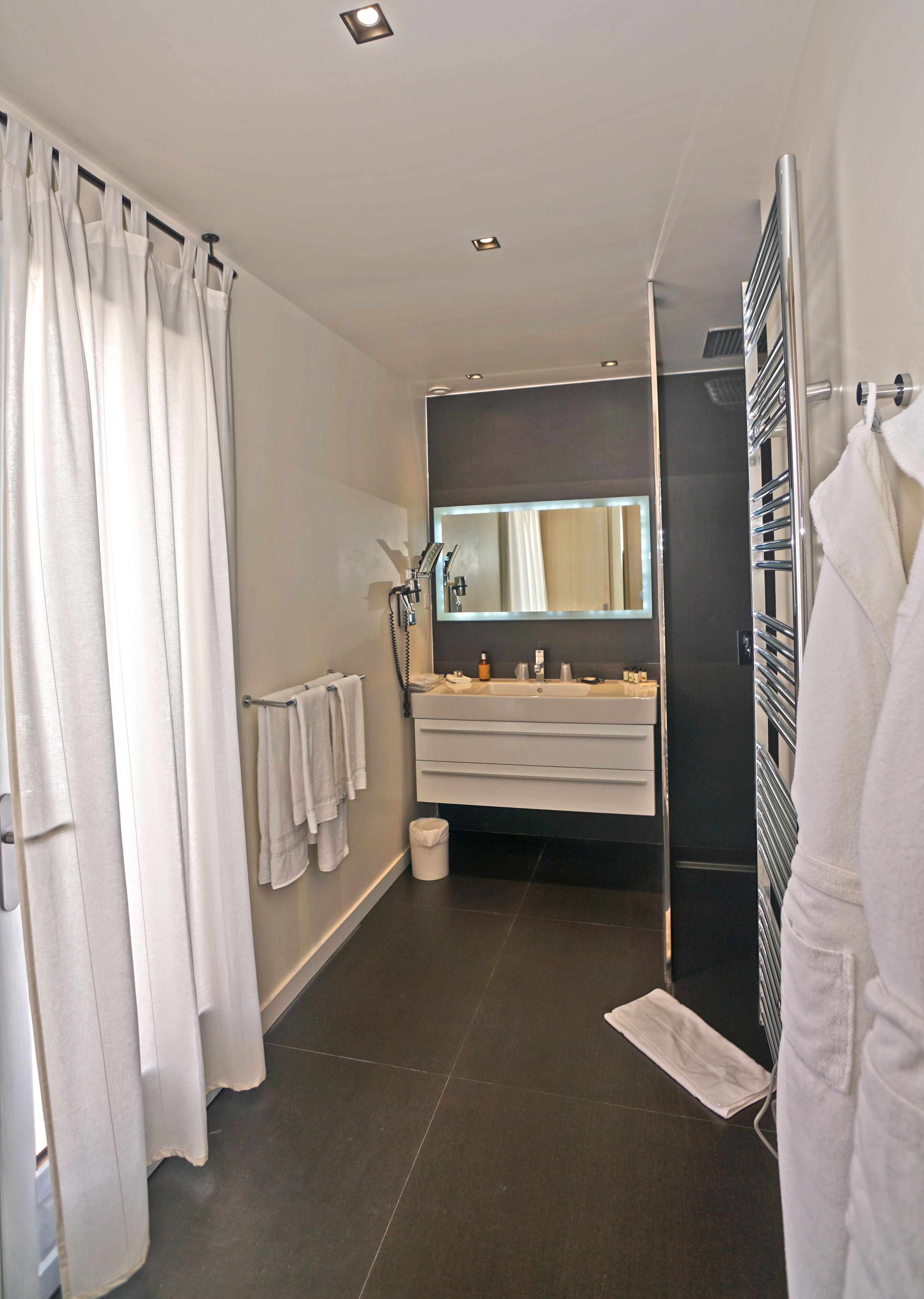 junior suite, terrace | bathroom amenities | rainfall showerhead, designer toiletries, hair dryer, bathrobes