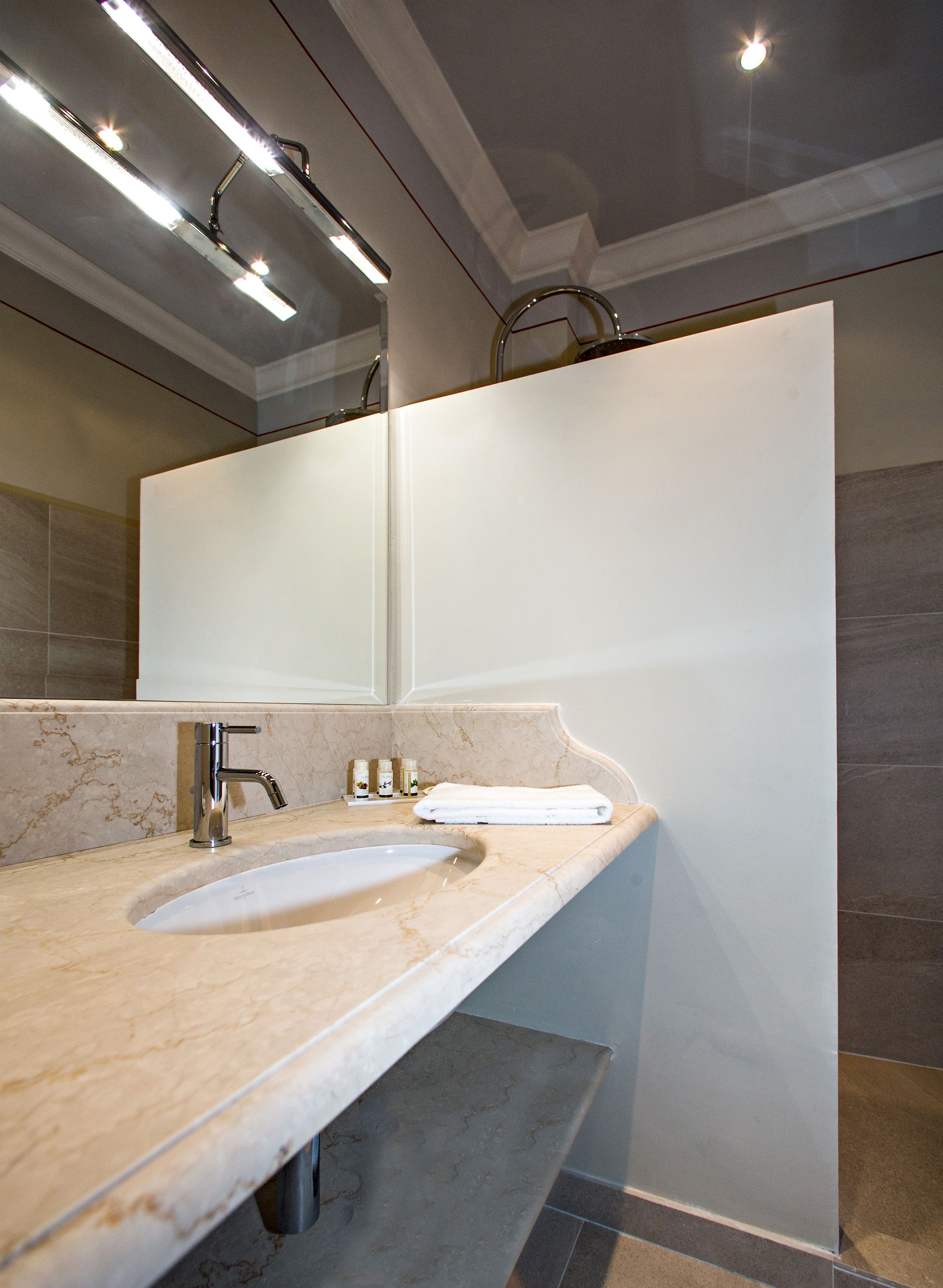 rainfall showerhead, designer toiletries, hair dryer, bathrobes