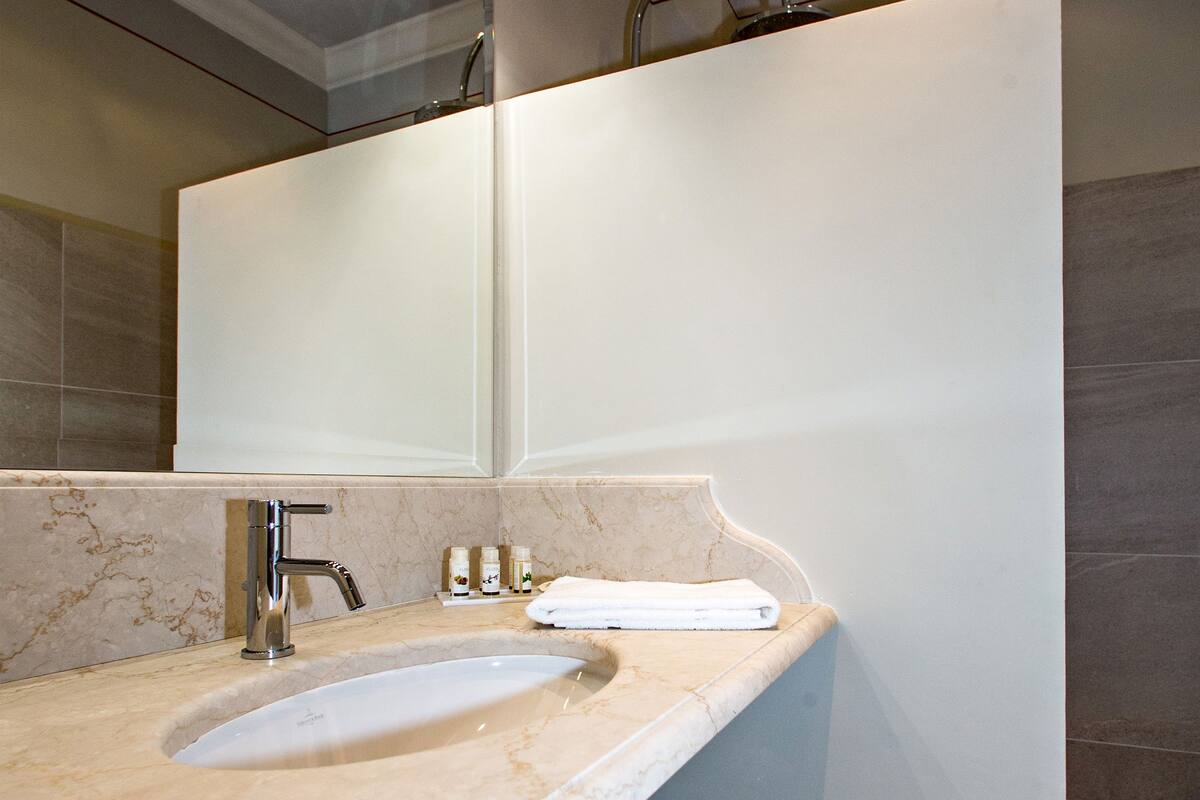 rainfall showerhead, designer toiletries, hair dryer, bathrobes