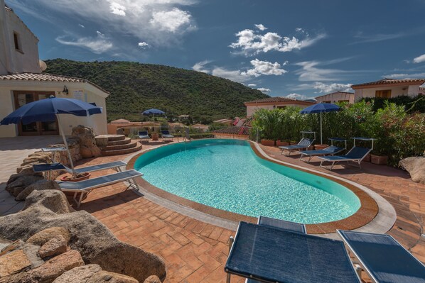 Outdoor pool, pool umbrellas, pool loungers