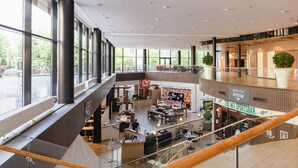 A multi-level shopping mall with a Holiday Club Arena, sports bar, and various retail stores. - Holiday Club Saimaan Rauha (Lappeenranta)