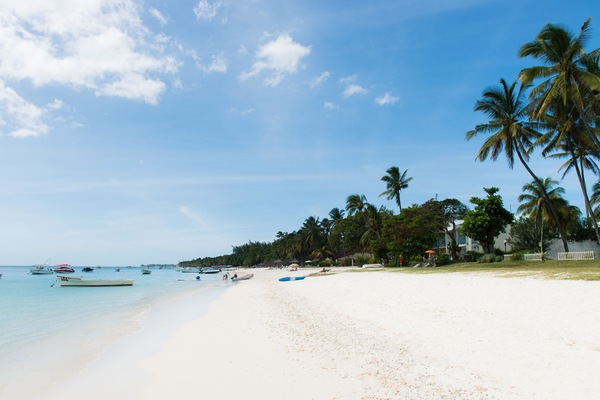 Beach nearby, white sand, beach umbrellas, beach towels