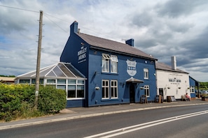 A traditional pub named 'The Birley Arms' with a distinctive blue facade, large windows, and a signboard. - The Birley Arms Hotel (Preston)