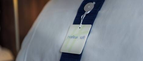 A pillow with a tag labeled 'melleux soft.'