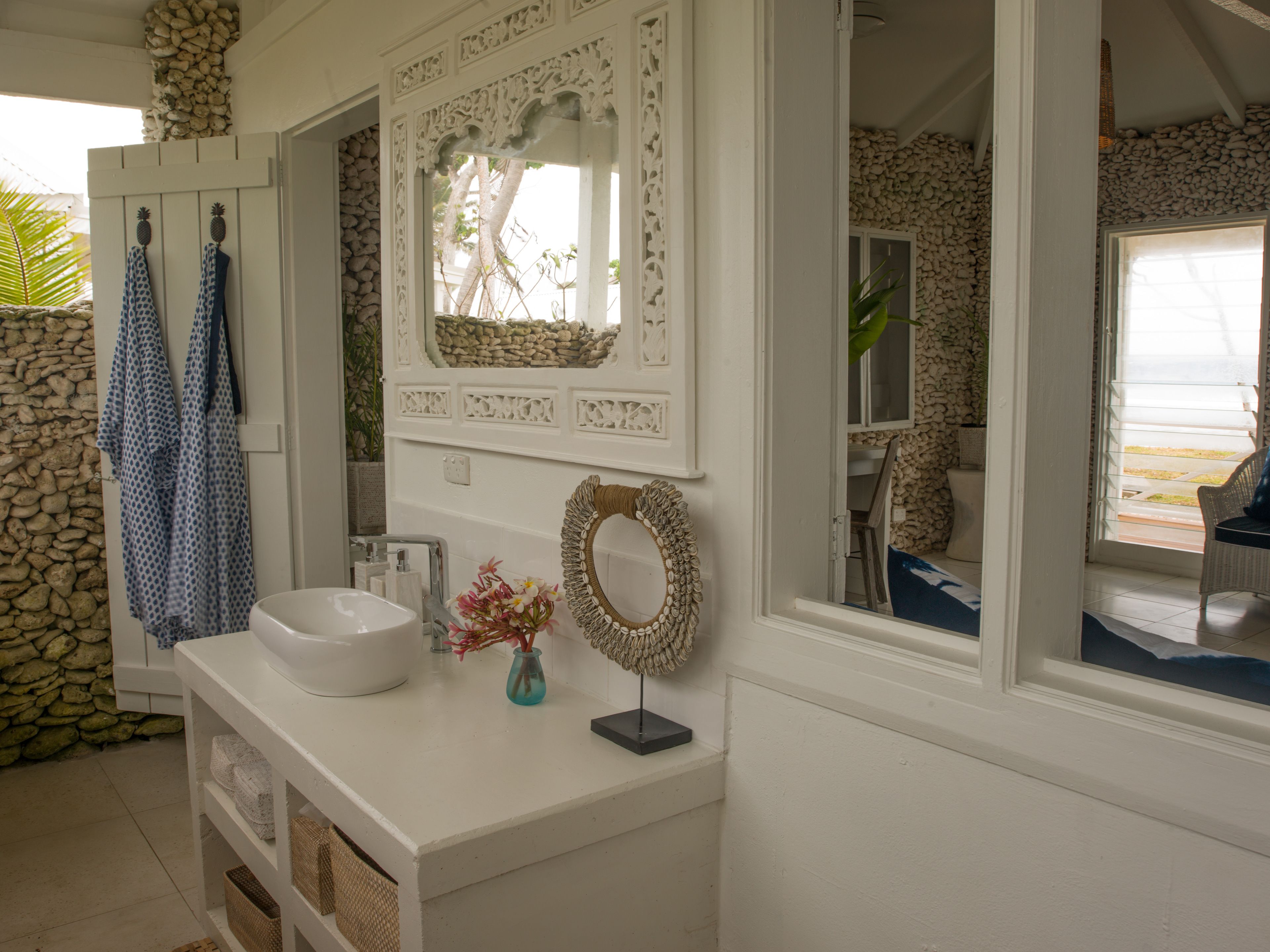 coral beachfront villa | bathroom | combined shower/bathtub, free toiletries, hair dryer, bathrobes