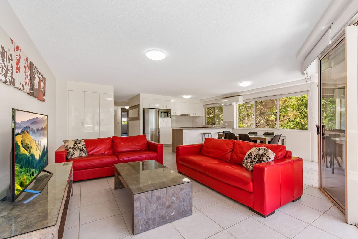 Mid-Level Three Bedroom Apartment | Living area | Plasma TV