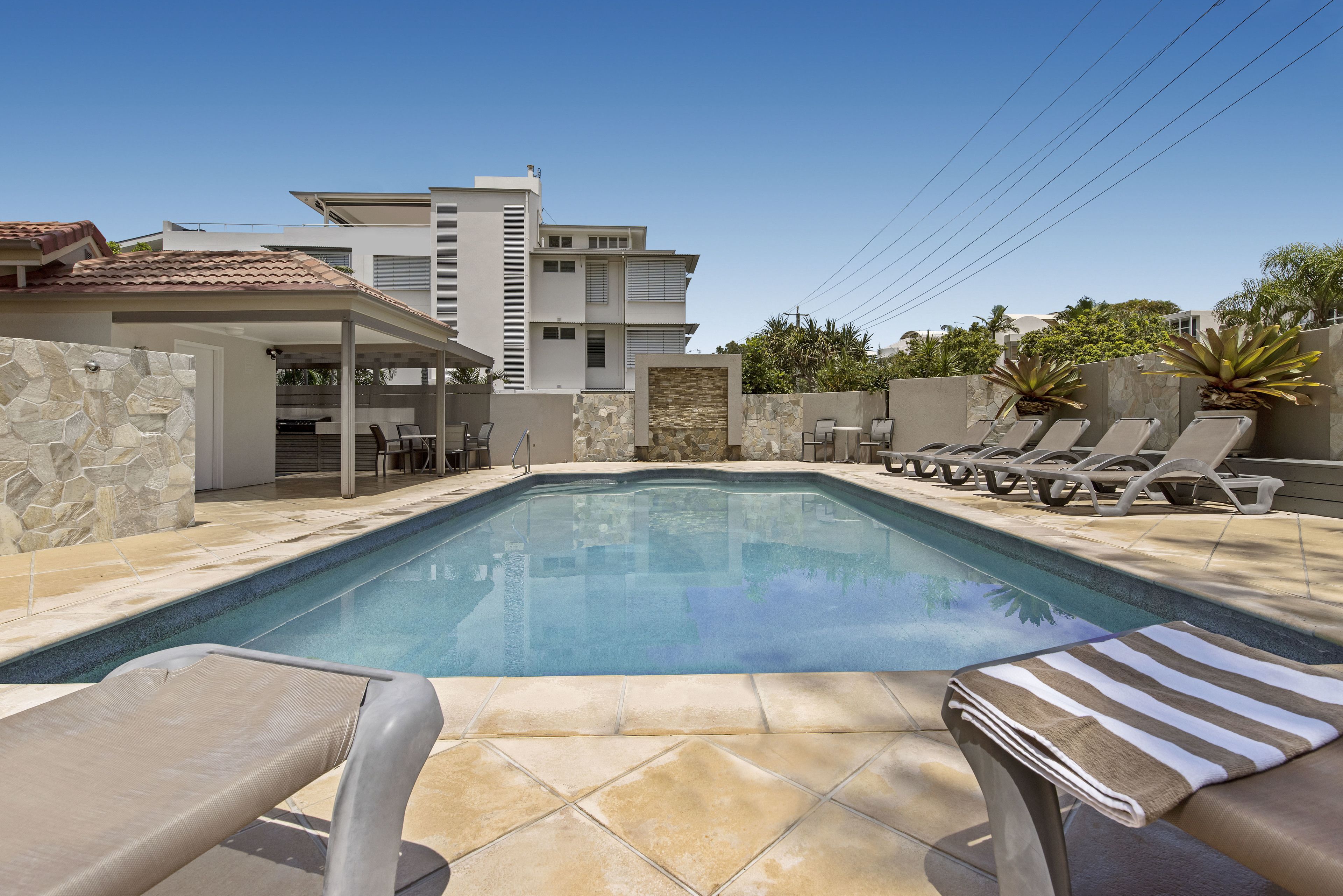 Outdoor pool, a heated pool, pool umbrellas