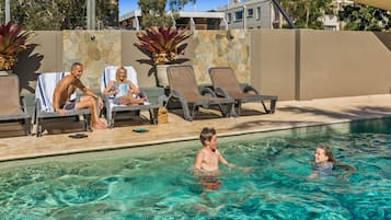 Outdoor pool, a heated pool, pool umbrellas