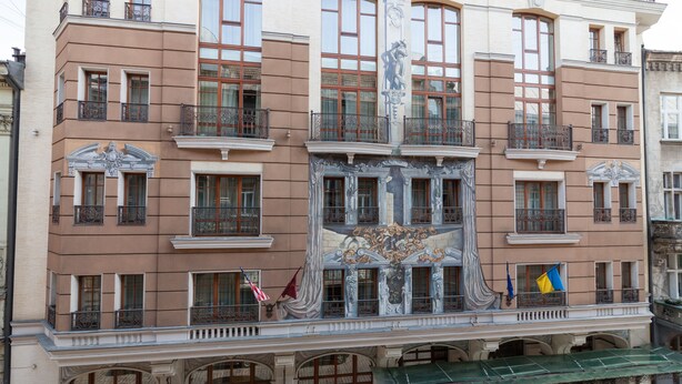 A multi-story building with ornate architectural details, including balconies and decorative elements. - Modern Properties Lviv (Lviv)