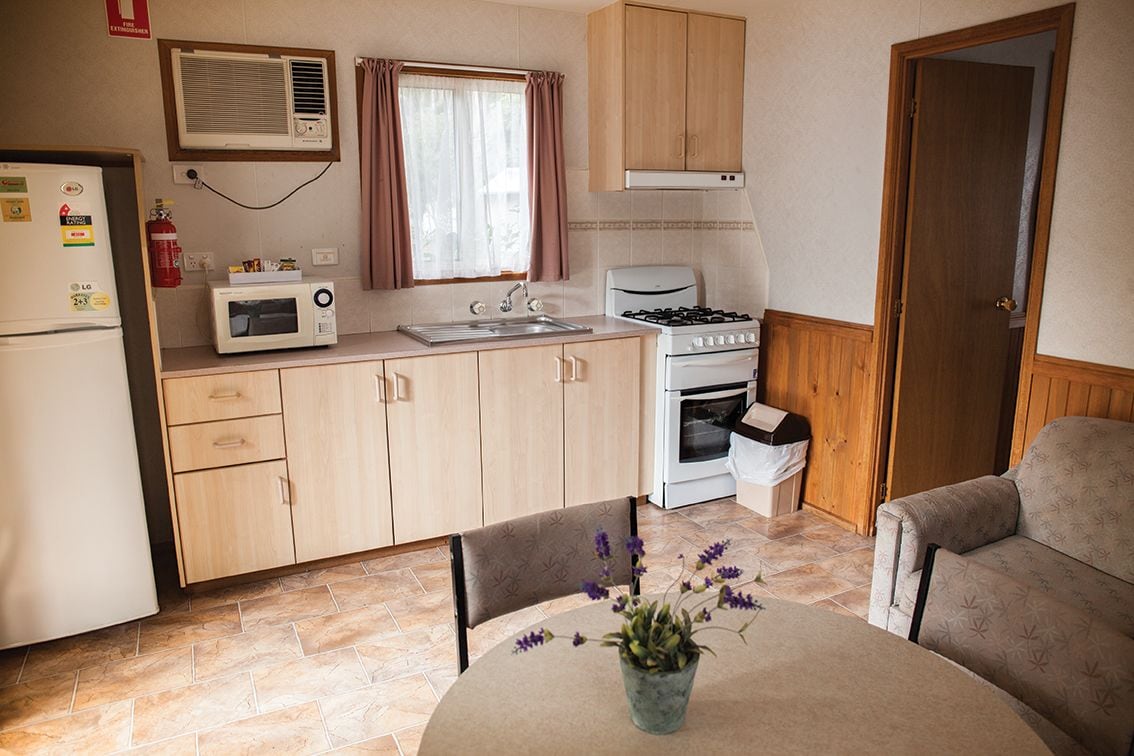 standard villa, 1 bedroom | private kitchenette | full-sized fridge, microwave, stovetop, cookware/dishes/utensils