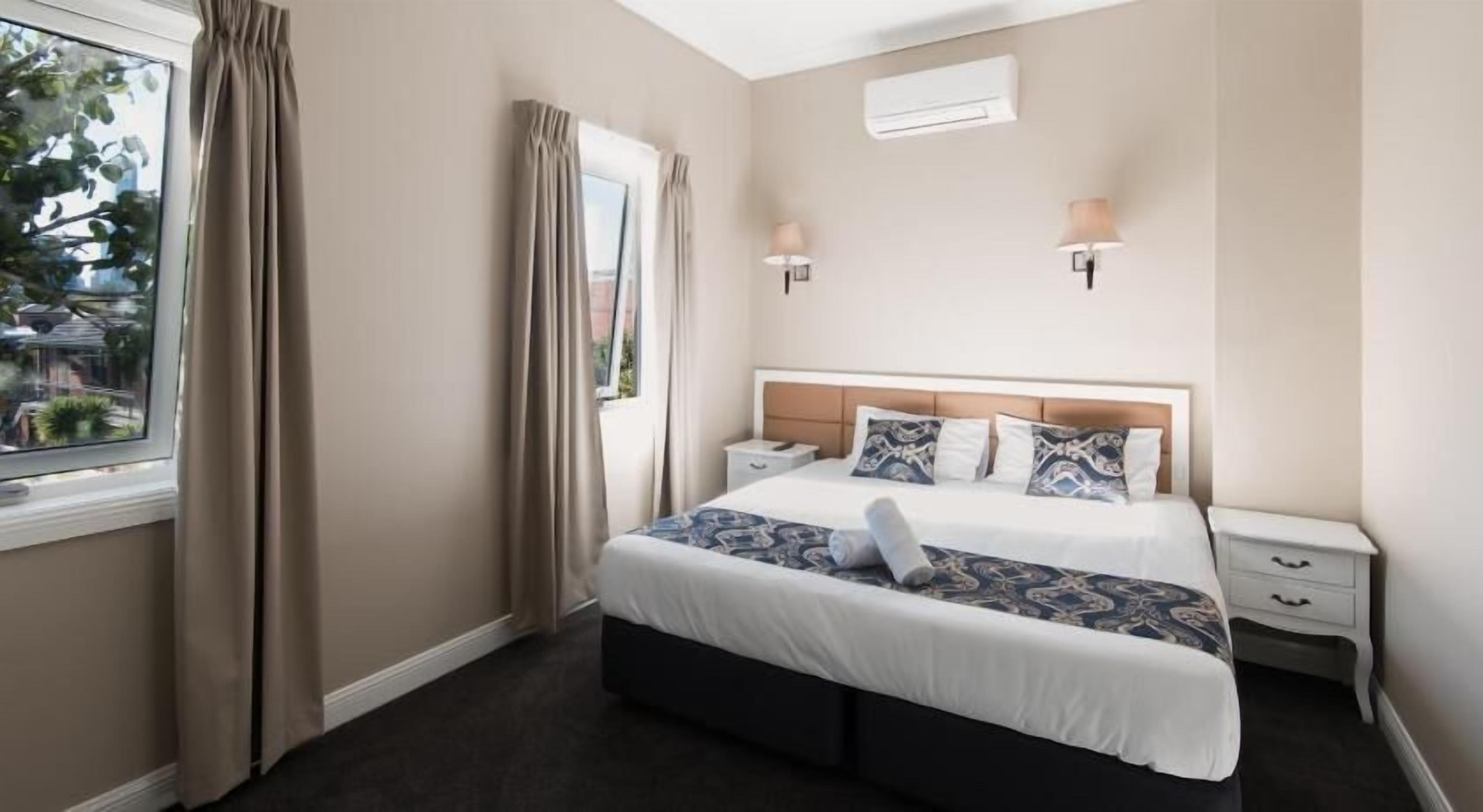 Desk, laptop workspace, blackout drapes, iron/ironing board