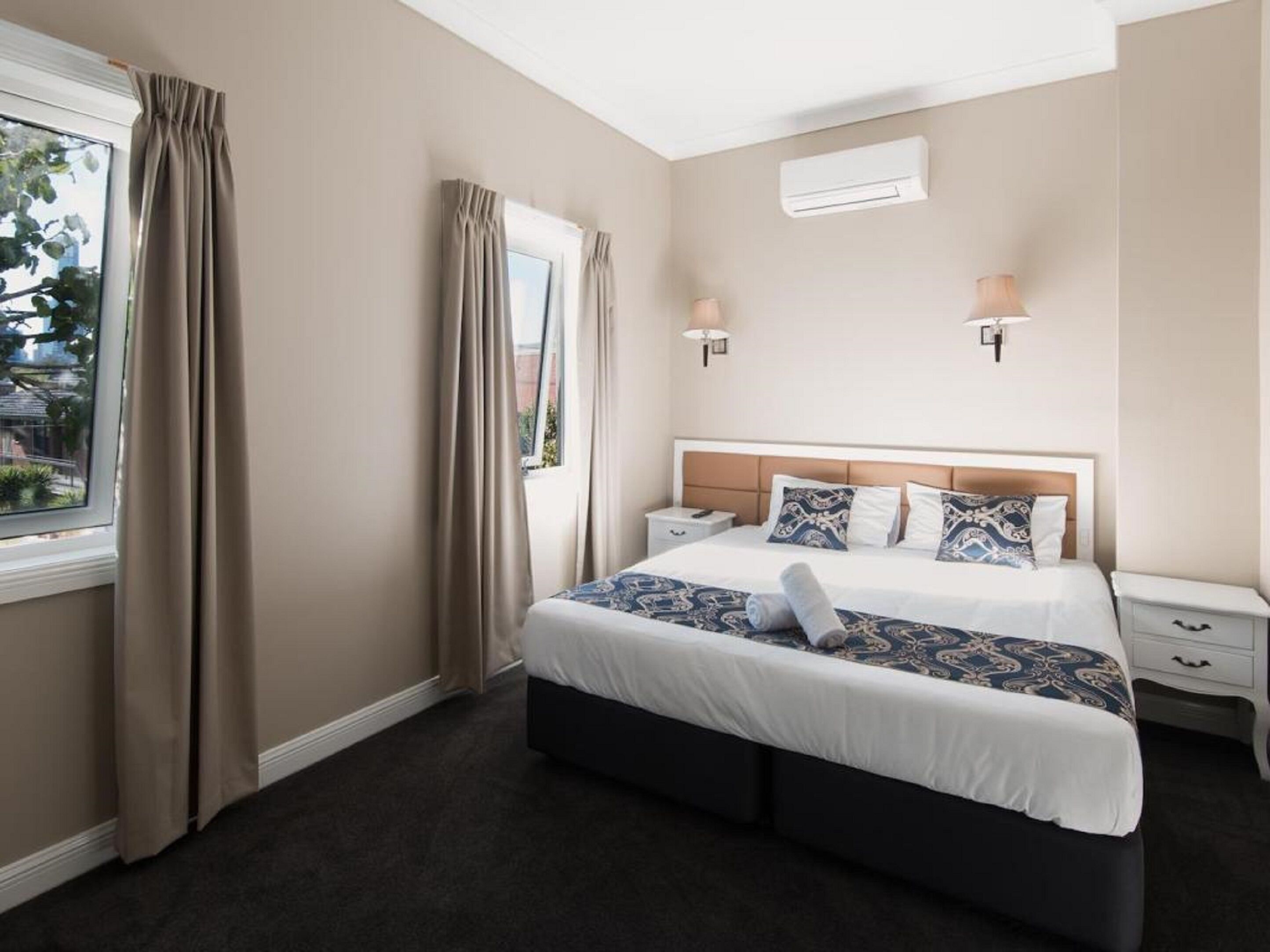 Desk, laptop workspace, blackout drapes, iron/ironing board