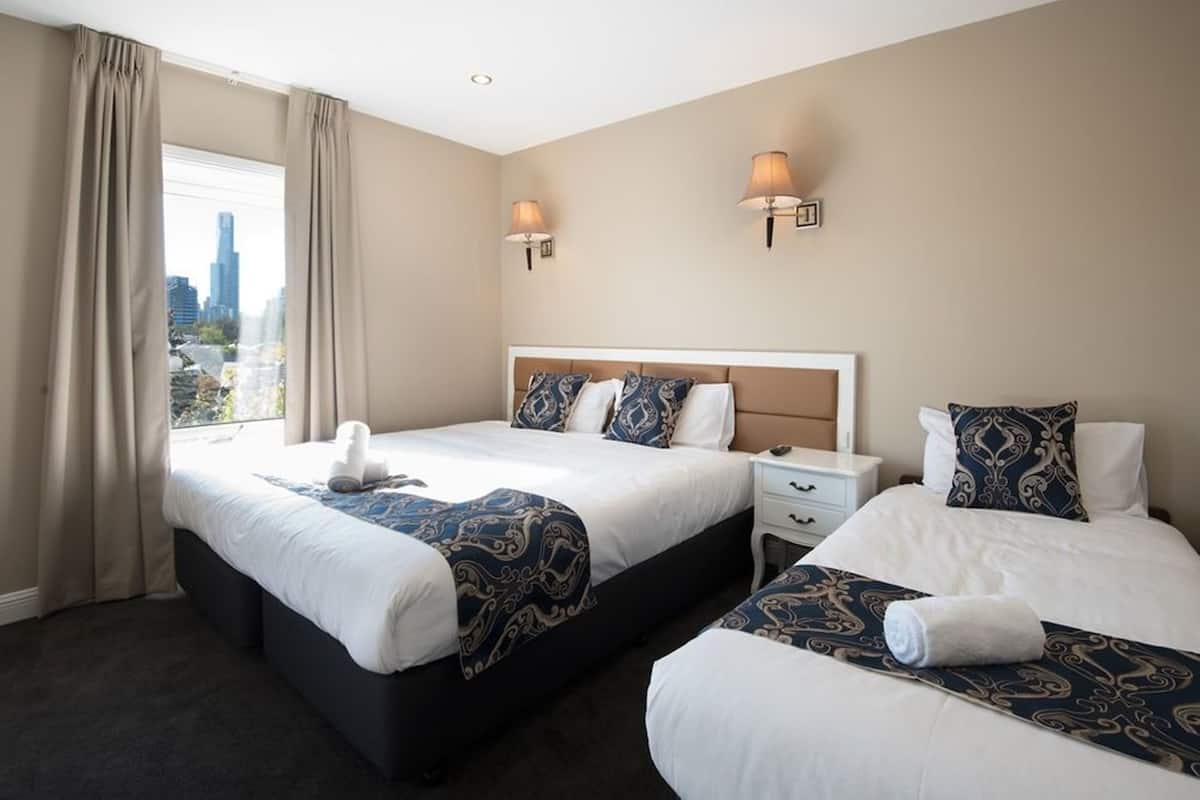 Desk, laptop workspace, blackout drapes, iron/ironing board